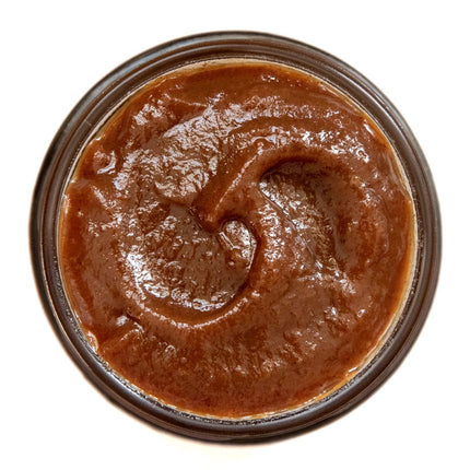 an above view of an open jar of the pumpkin maple butter to show the color and rich texture