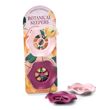 The botanical keepers set in their package next to the two botanical keepers on a white background