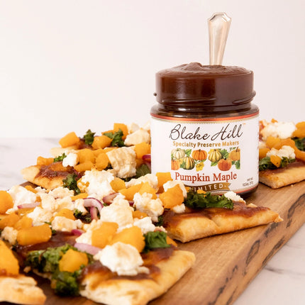 a  board with flatbread and a jar of pumpkin maple butter