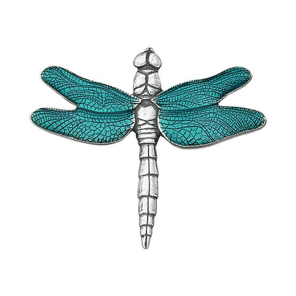an intricately detailed pewter brooch in the shape of a dragonfly with brilliant teal wings