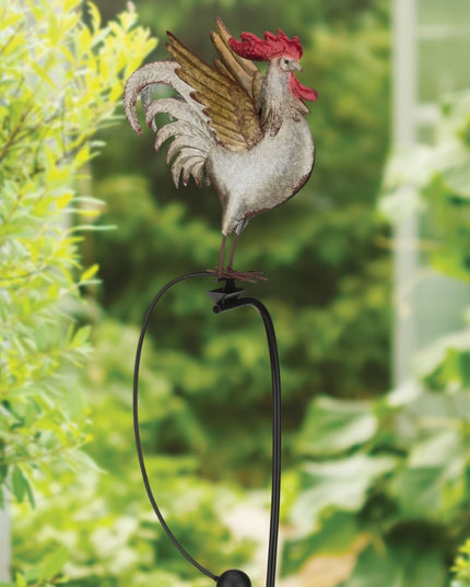 A realistic spot to place A metal garden stake featuring a colorful rooster with detailed feathers, perched on a rocker that moves in the wind.