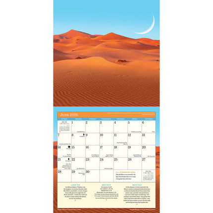 interior page of the 2026 Moon calendar open to the June monthly page featuring a stunning photo of red sand dunes with a large crescent moon rising in the blue sky