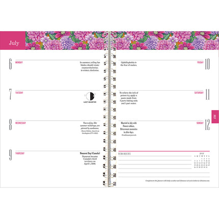 Interior page of the Old Farmer's Almanac planner showing the July 6-12 weekly planner page spread noting moon phases, holidays, with blooming pink and purple dahlia illustration at the top of the pages