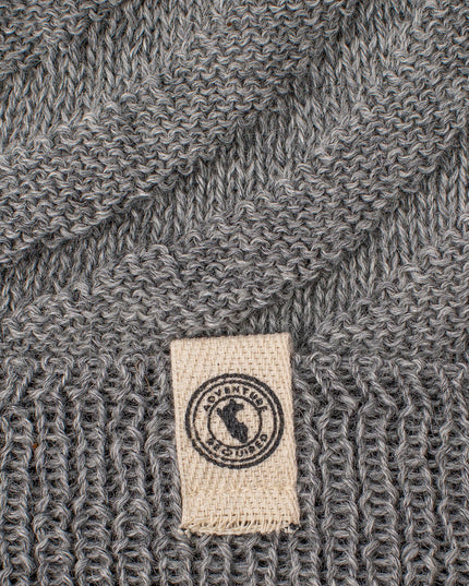 a close up of the gray Kingsley alpaca hat highlighting the cream colored label on the fold of the hat and the detailed diagonal stitch pattern of the hat