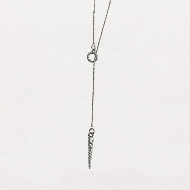 Stylish pewter icicle pendant necklace on an 18-inch sterling silver lariat chain, featuring a subtle, elegant design inspired by vintage Bakelite ornaments against a white background
