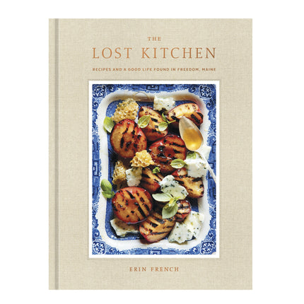 Book cover of 'The Lost Kitchen' with a photograph of food on a blue and white plate.