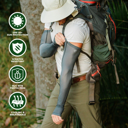 a model in the woods with a sun hat, backpack, and wearing the gray protection sleeves. text around the image reads "UPF 50+ Protection, Scratch Resistant, Bug Bite Protection, and Cooling & Breathable"