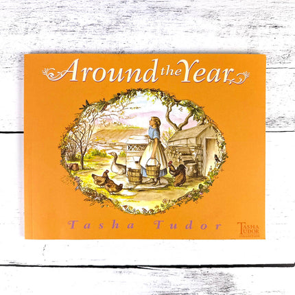 Book cover of 'Around the Year' by Tasha Tudor with an illustration of a woman and chickens on an orange background.
