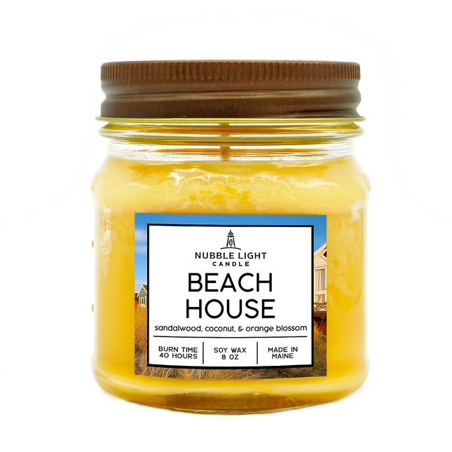 Jar candle labeled 'Beach House' by Nubble Light Candle on a white background