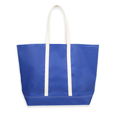 Blue tote bag with white handles on a white background