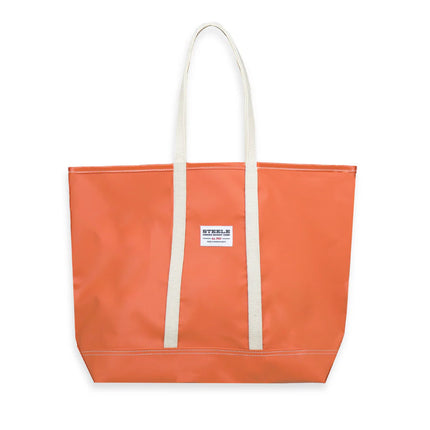 Orange tote bag with white handles on a white background