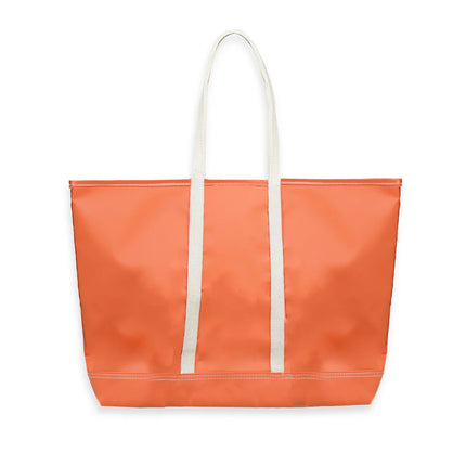 Orange tote bag with white handles on a white background
