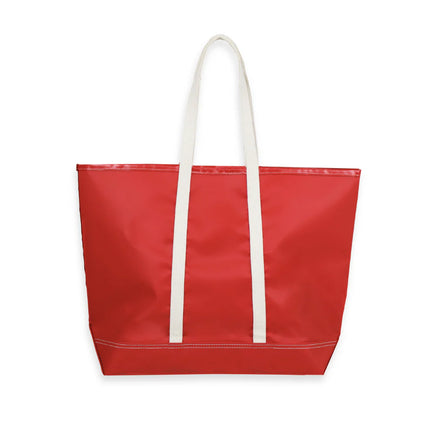 Red tote bag with white handles on a white background