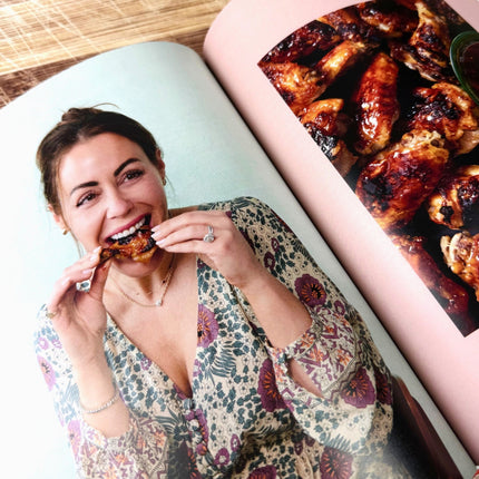 interior book page with Kat Ashmore eating chicken wings