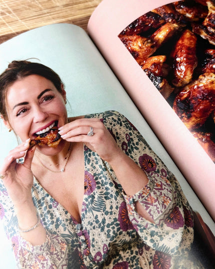 interior book page with Kat Ashmore eating chicken wings