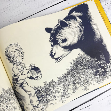 Illustration of a child and a bear from a book