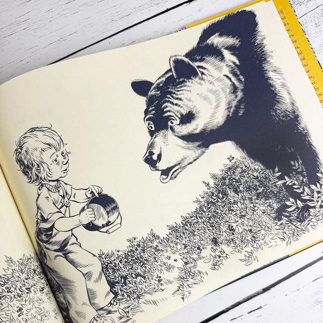 Illustration of a child and a bear from a book