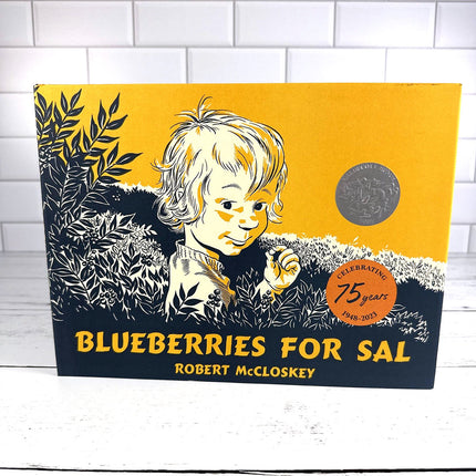 Book cover of 'Blueberries for Sal' by Robert McCloskey with a child illustration on a yellow and black background.