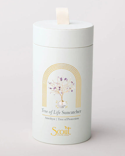 Cylindrical product packaging with 'Tree of Life Suncatcher' design on a light gray background