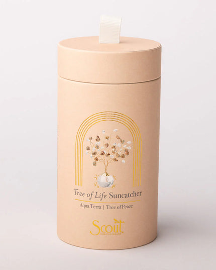 Beige cylindrical container with 'Scout' branding and 'Tree of Life Suncatcher' design on a light gray background
