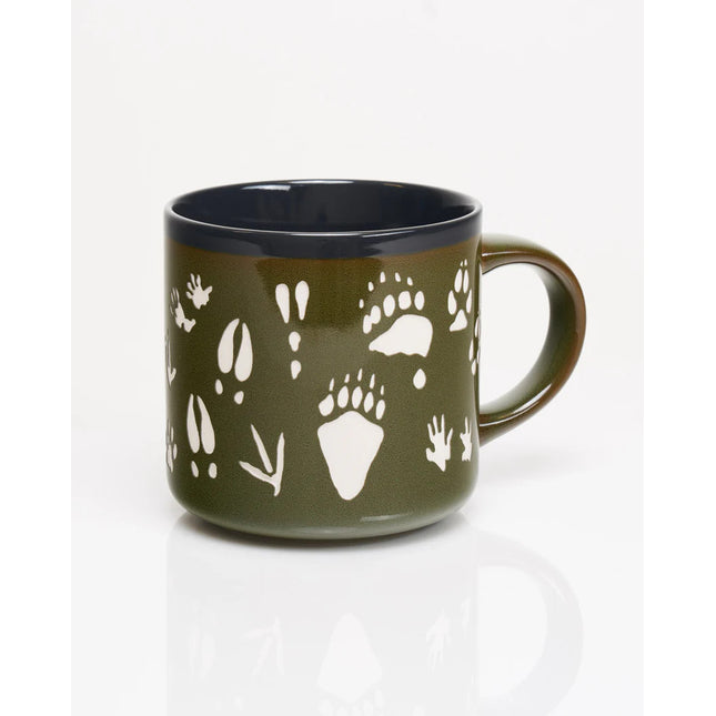 the other side of a deep green coffee mug with various animal tracks in white including paw prints, hoof prints, birds, and more