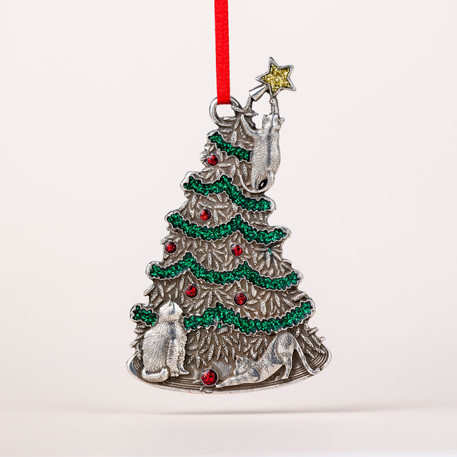 Decorative Christmas tree ornament with silver base, green and red decorations, and a red ribbon on a white background.