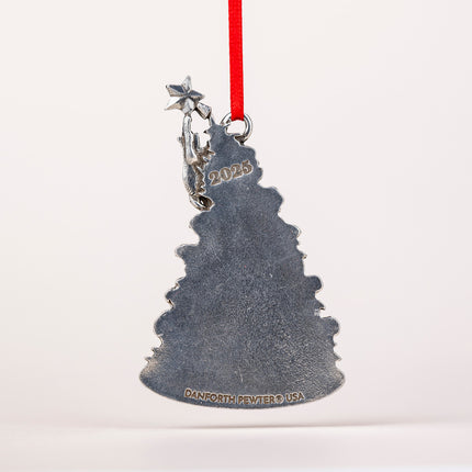 Metal Christmas tree ornament with '2023' and 'Danforth Pewter USA' text, hanging on a red ribbon against a white background.