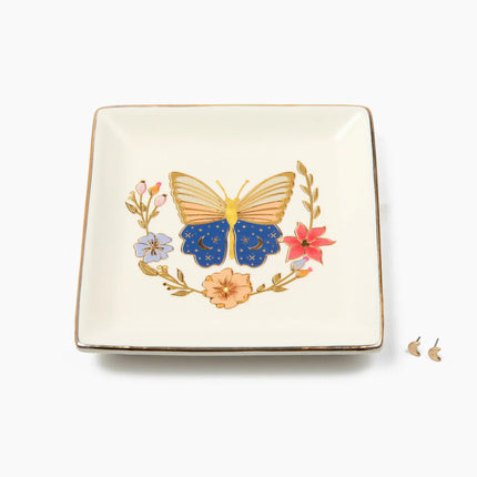 Decorative square plate with a butterfly and floral design on a white background