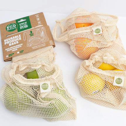 Reusable produce bags with fruits and packaging on a white background