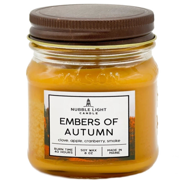 Jar candle labeled 'Embers of Autumn' by Nubble Light Candle on a white background
