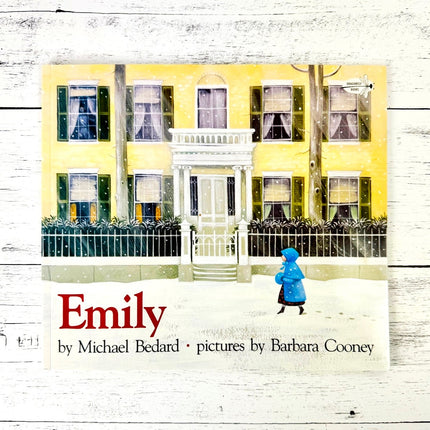 Book cover of 'Emily' with a yellow house and person in a blue coat on a white background
