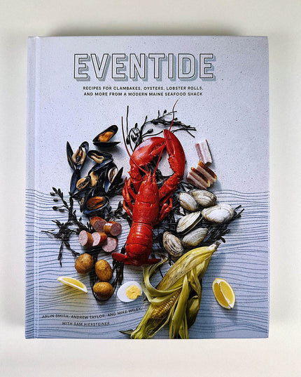 Cookbook titled 'Eventide' with seafood imagery on a light background