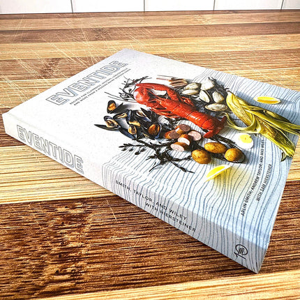 Book titled 'Eventide' on a wooden surface