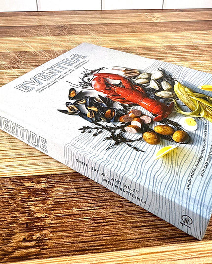 Book titled 'Eventide' on a wooden surface