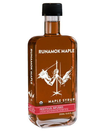 A bottle of festivus infused maple syrup against a white background