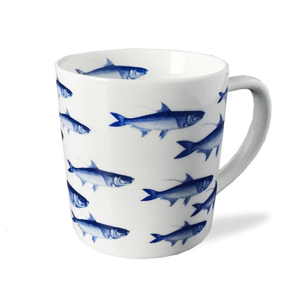 White mug with blue fish pattern on a white background