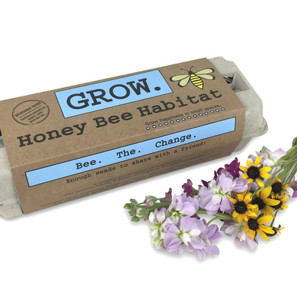 The Grow Honey Bee Habitat package alongside a bouquet of fresh cut flowers that bees love