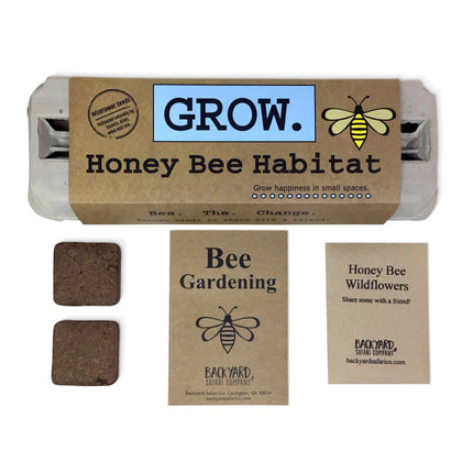 a selection of the contents of the Grow Honey Bee Habitat garden kit: the egg carton package, starter soil, bee garden booklet, and wildflower seeds