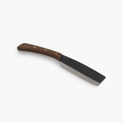the japanese nata hatchet laying flat on a white surface