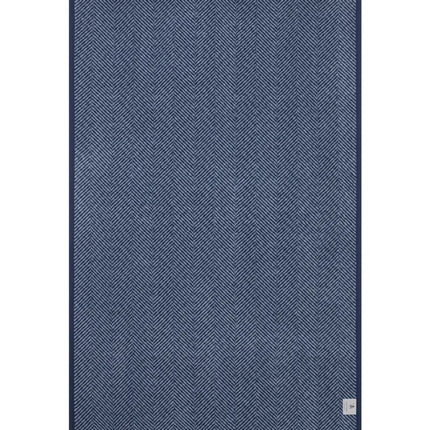 The back of the Harborview Herringbone Navy Blanket showing the mirror image and reverse color of the full size and Herringbone design in Navy and Fog color scheme