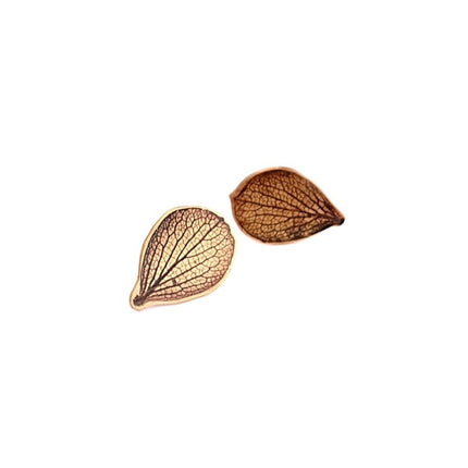 Pair of brass hydrangea petal-shaped earrings on a white background