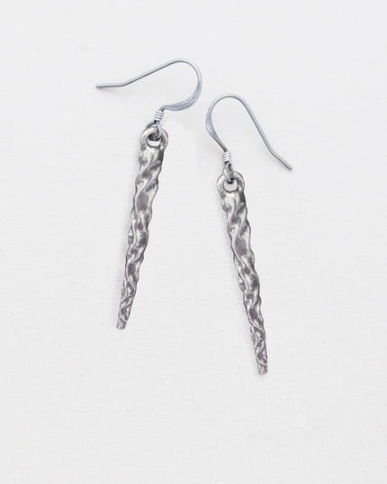 pewter icicle earrings laying flat on a white background