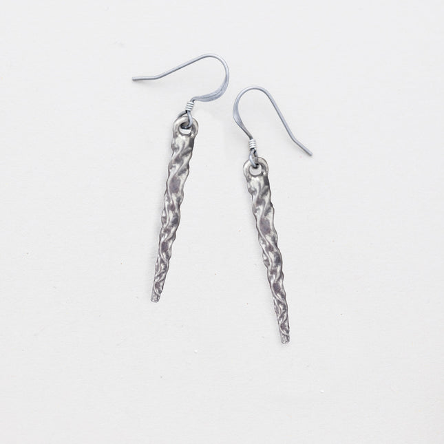 pewter icicle earrings laying flat on a white background