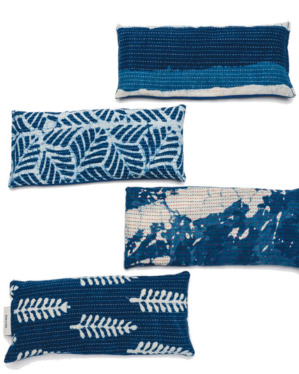 a vertical stack of each available color/pattern of the indigo eye pillows
