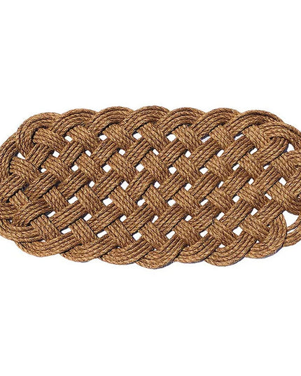 a large manila rope doormat with an intricate hand woven pattern