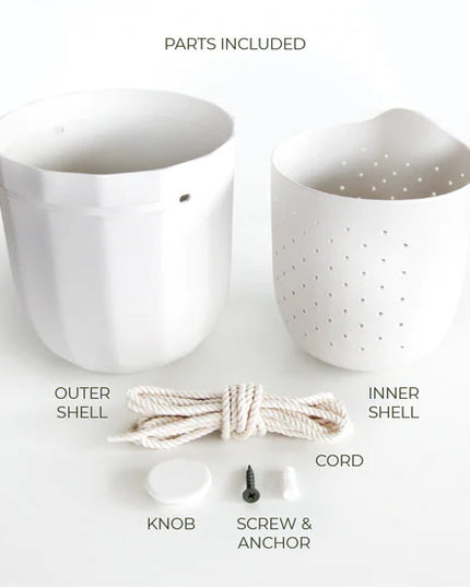 the white loop planter and all of its parts and pieces: outer shell, inner shell, knob for the wall, screw and anchor, and hanging cord