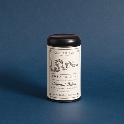 Tea canister with label on a blue background
