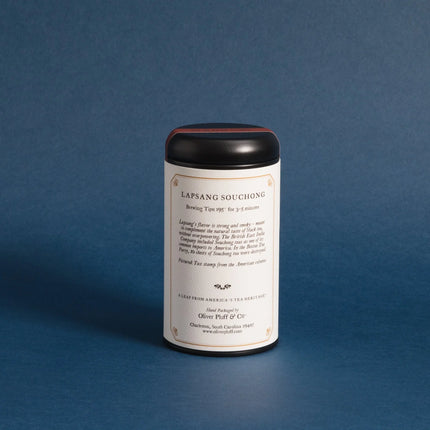 Tea canister with label on a blue background