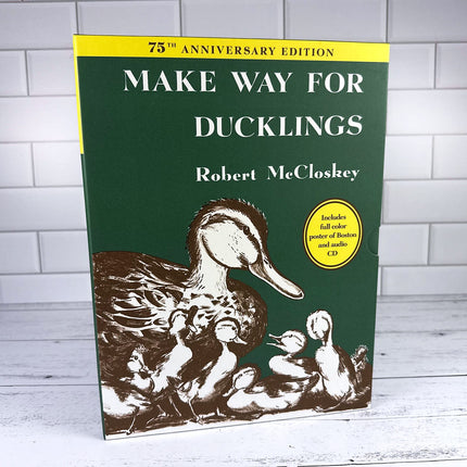 Book cover of 'Make Way for Ducklings' by Robert McCloskey with a green background and yellow accents.