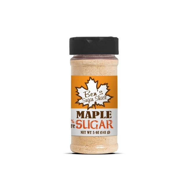 a cylindrical spice bottle with light brown contents and a label that reads "Ben's Sugar Shack Maple Sugar 5oz" 